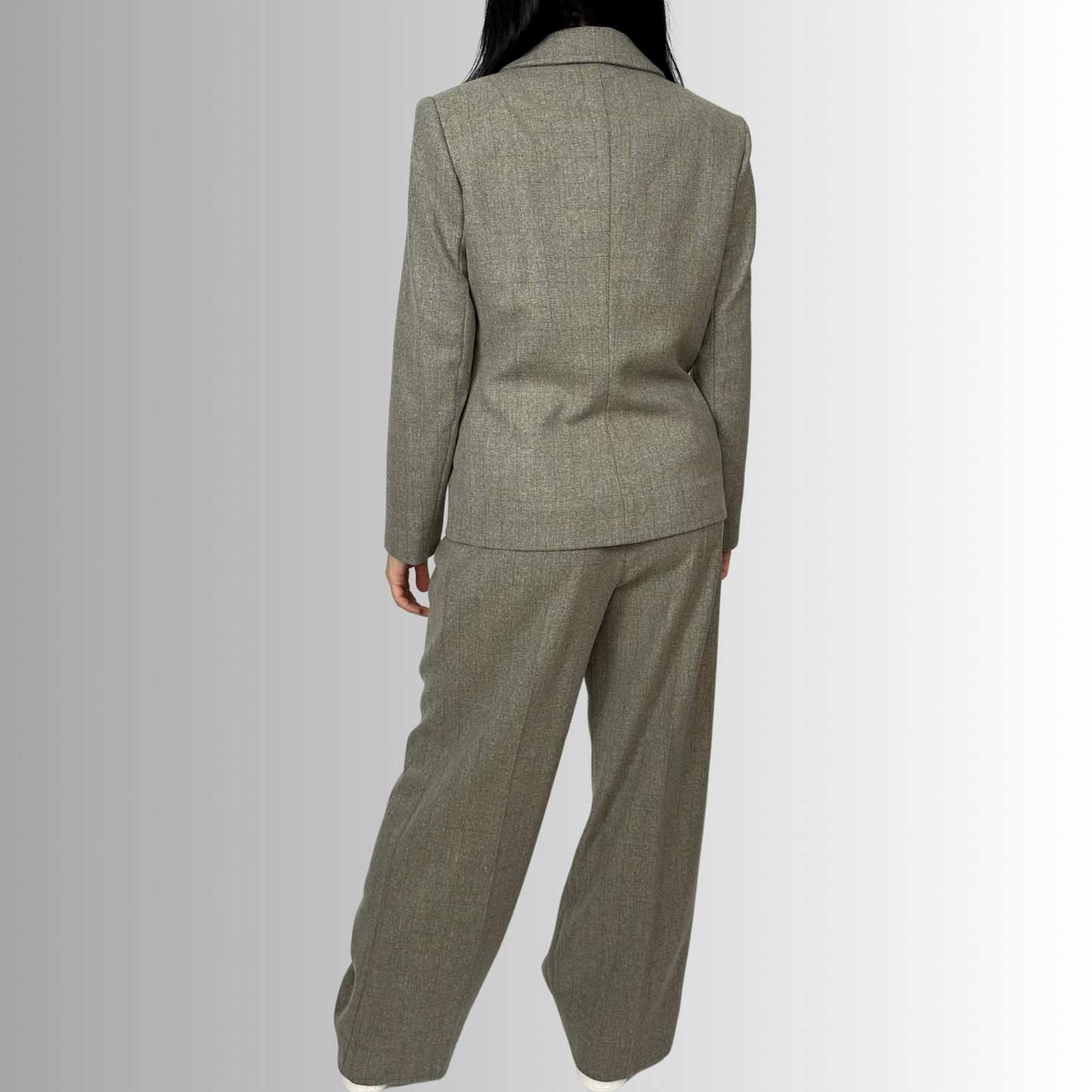 Back view of Sartorial Flair’s eco-friendly Zeo blazer in heather gray wool, showcasing a tailored fit and ethical production for women.