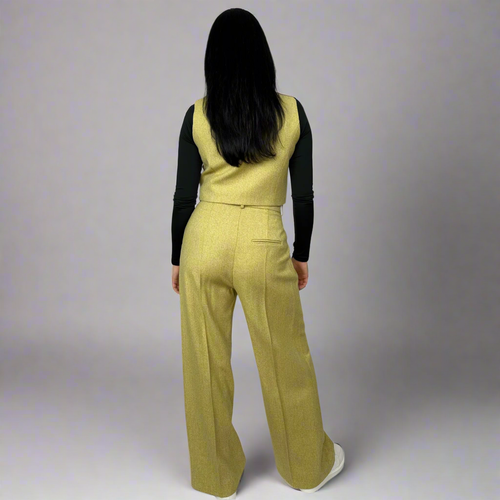 Back view of Sartorial Flair’s Camilla Mustard Wide-Leg Trousers, emphasizing the expert tailoring and fit around the waist and hips for a flattering silhouette.