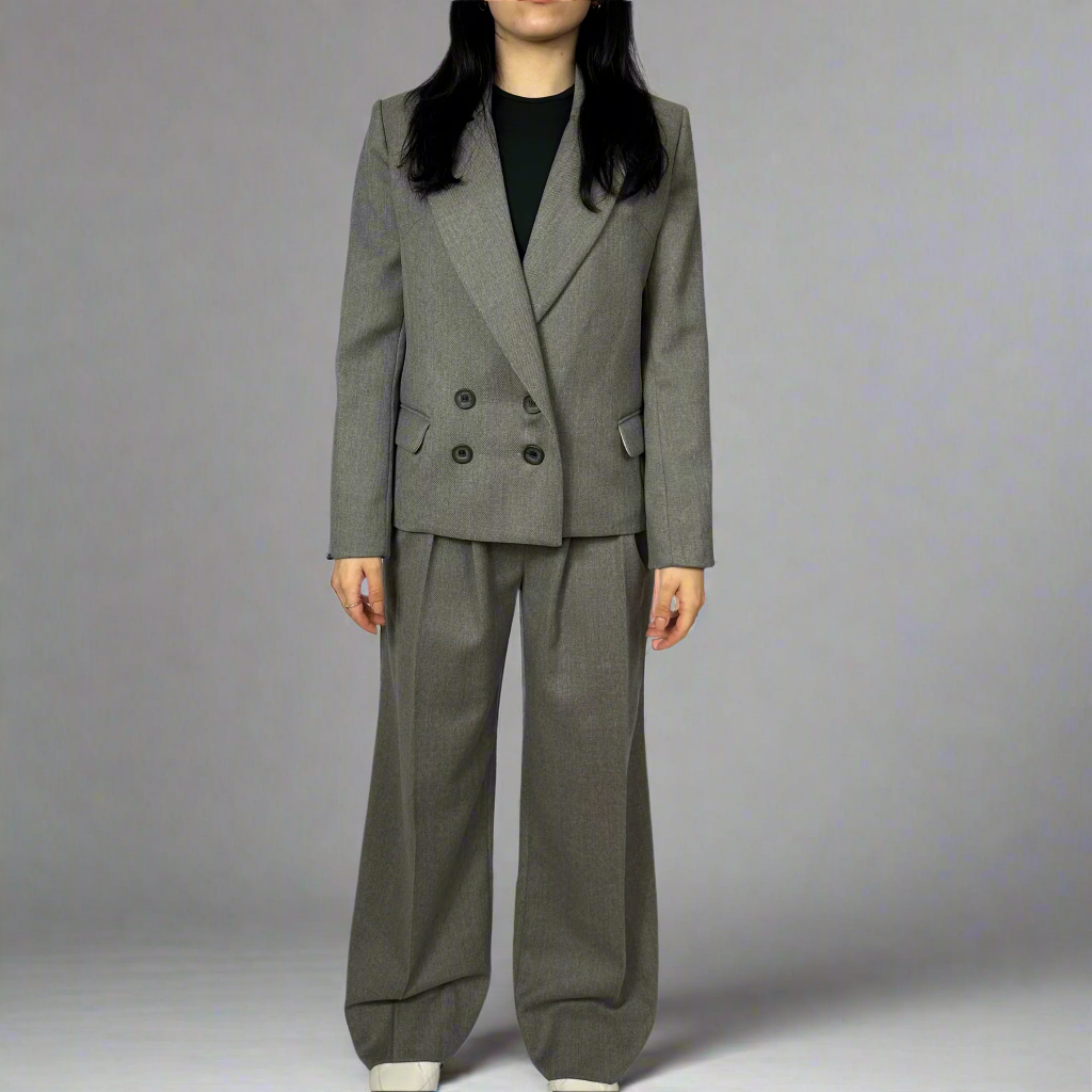 A styled look featuring the Isabella Charcoal Blazer paired with matching trousers, embodying professional elegance and refined tailoring for the modern woman.