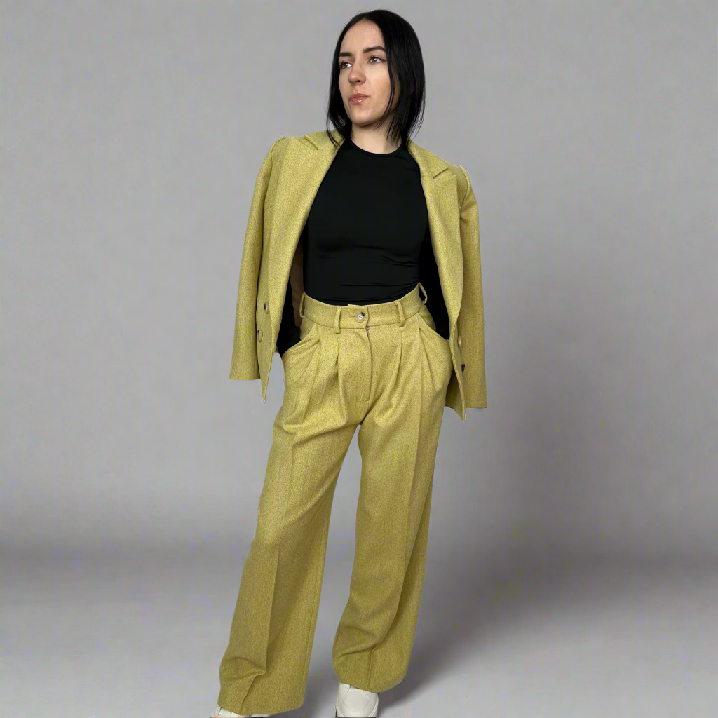 Model wearing Sartorial Flair’s Camilla Mustard Wide-Leg Trousers paired with a matching double-breasted blazer, showcasing the suit’s cohesive and stylish design.