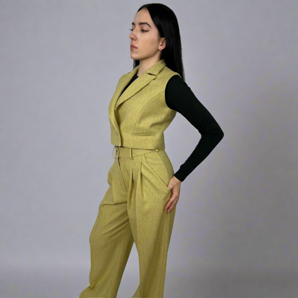 Front view of a woman wearing the Camilla mustard wool waistcoat, styled for a modern and chic look, showcasing the detailed craftsmanship and vibrant color.