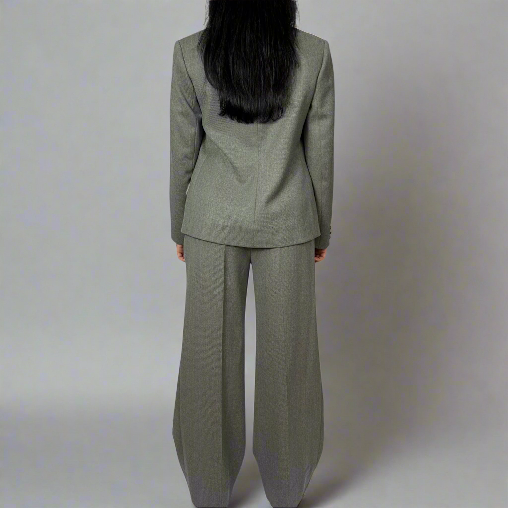 Back view of Sartorial Flair’s Isabella Blazer in charcoal grey, displaying the elegant structure and seamless tailoring for a polished, timeless silhouette.