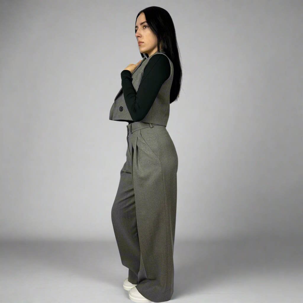 Close-up of the Isabella Waistcoat in charcoal gray, focusing on the meticulous craftsmanship and modern cut.