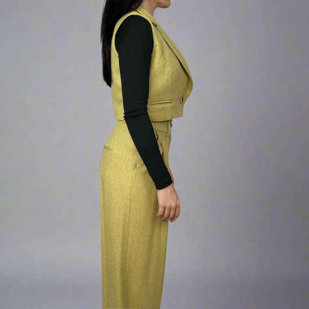 Fashion forward styling of the Camilla mustard waistcoat paired with high-waisted trousers, illustrating how it enhances an outfit with its structured design.”